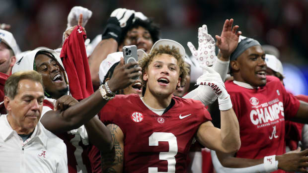 Dec 2, 2023; Atlanta, GA, USA; Alabama Crimson Tide wide receiver Jermaine Burton (3) celebrates with teammates on the podium after defeating the Georgia Bulldogs in the SEC championship game at Mercedes-Benz Stadium.